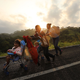 Members of the Central American migrant caravan move to the next town at dawn on November 02, 2018 in Matias Romero, Mexico.